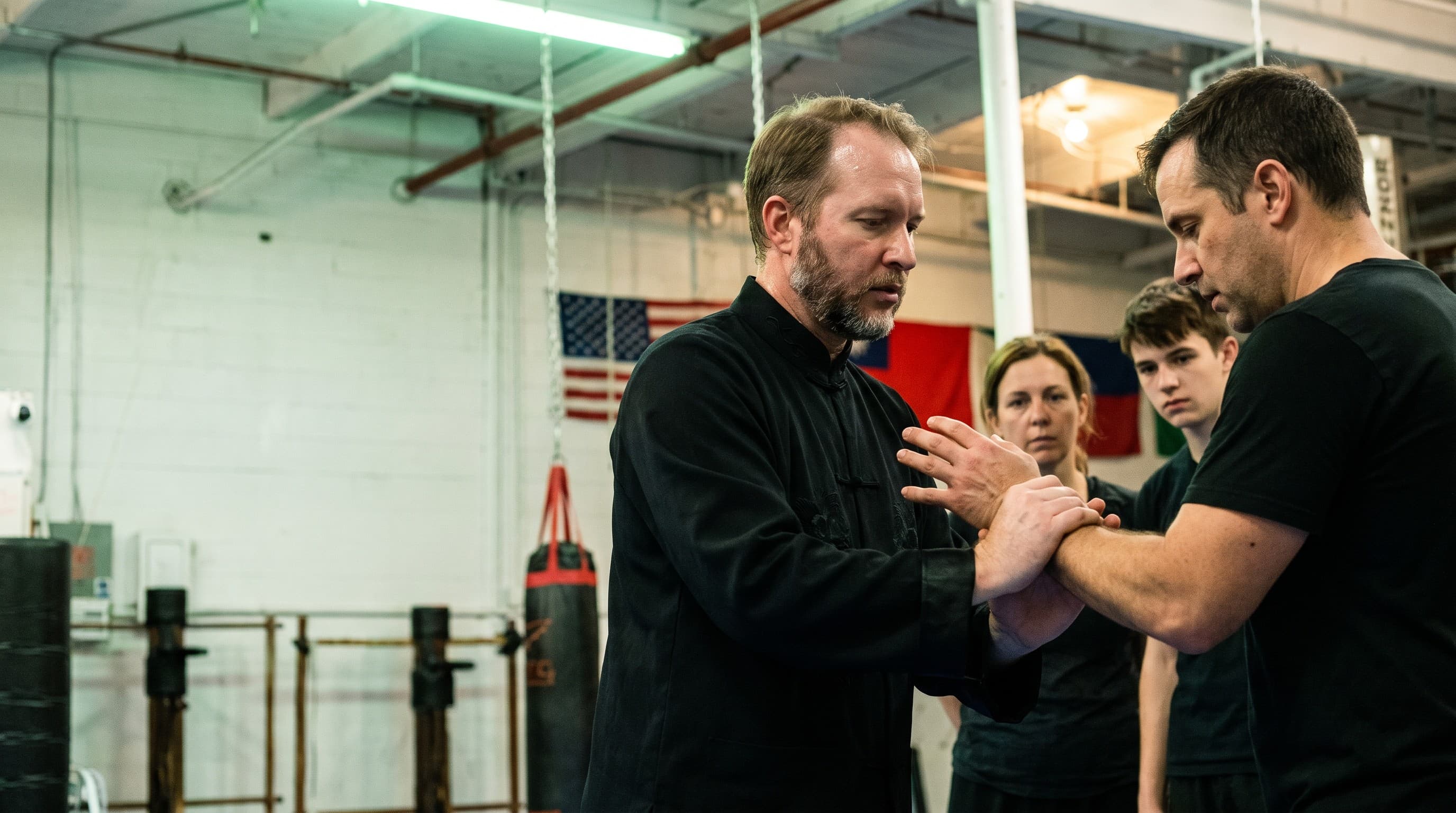 Sifu Michael Johnson demonstrating a technique with a student