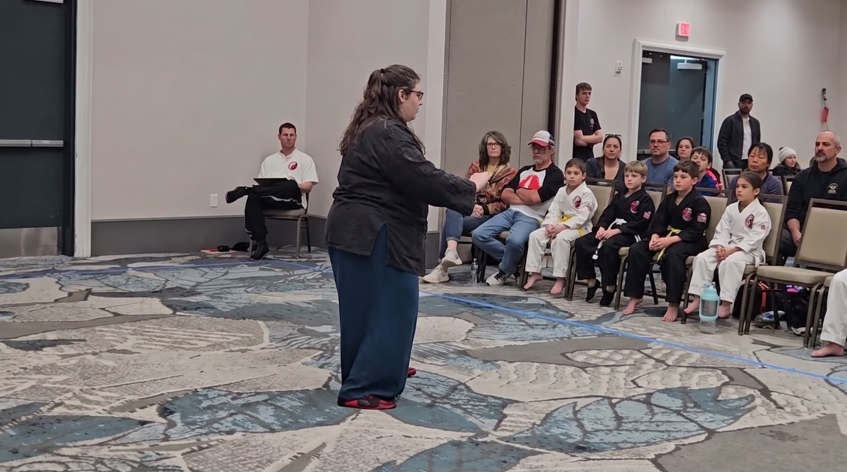 A student performing a slow form at a Cloud Forest event